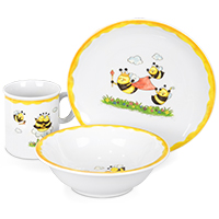 A plate, a bowl and a cup with a bee motif are arranged as a group in the centre.