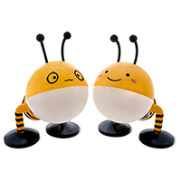 Two bee lamps stand next to each other