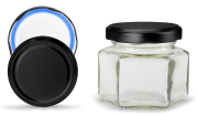 Sechseckglas 106 ml mit 53er schwarz-matt Blueseal®, Frontansicht, ein Deckel stehend daneben