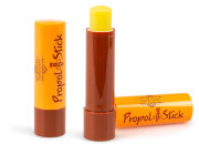 ApiLinda® Propol Stick, Frontansicht, ein Stift offen stehend, Stiftkappe liegend dahinter, ein Stift geschlossen stehend daneben